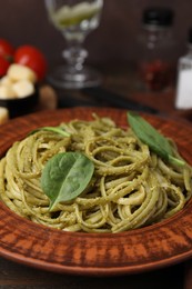 Photo of Tasty pasta with spinach on table, closeup