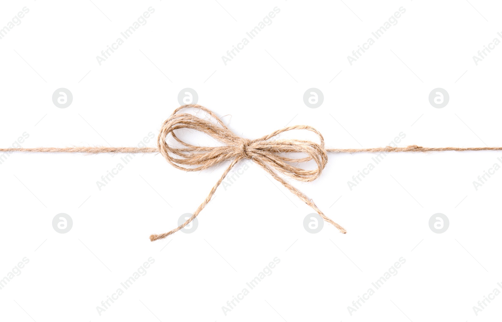 Photo of Linen rope string with bow isolated on white, top view