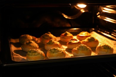 Photo of Baking puff pastry with tasty filling in oven