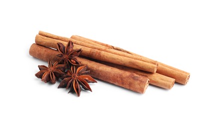 Photo of Aromatic cinnamon sticks and anise stars isolated on white