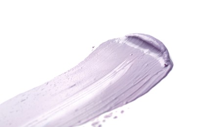 Photo of Stroke of purple color correcting concealer isolated on white