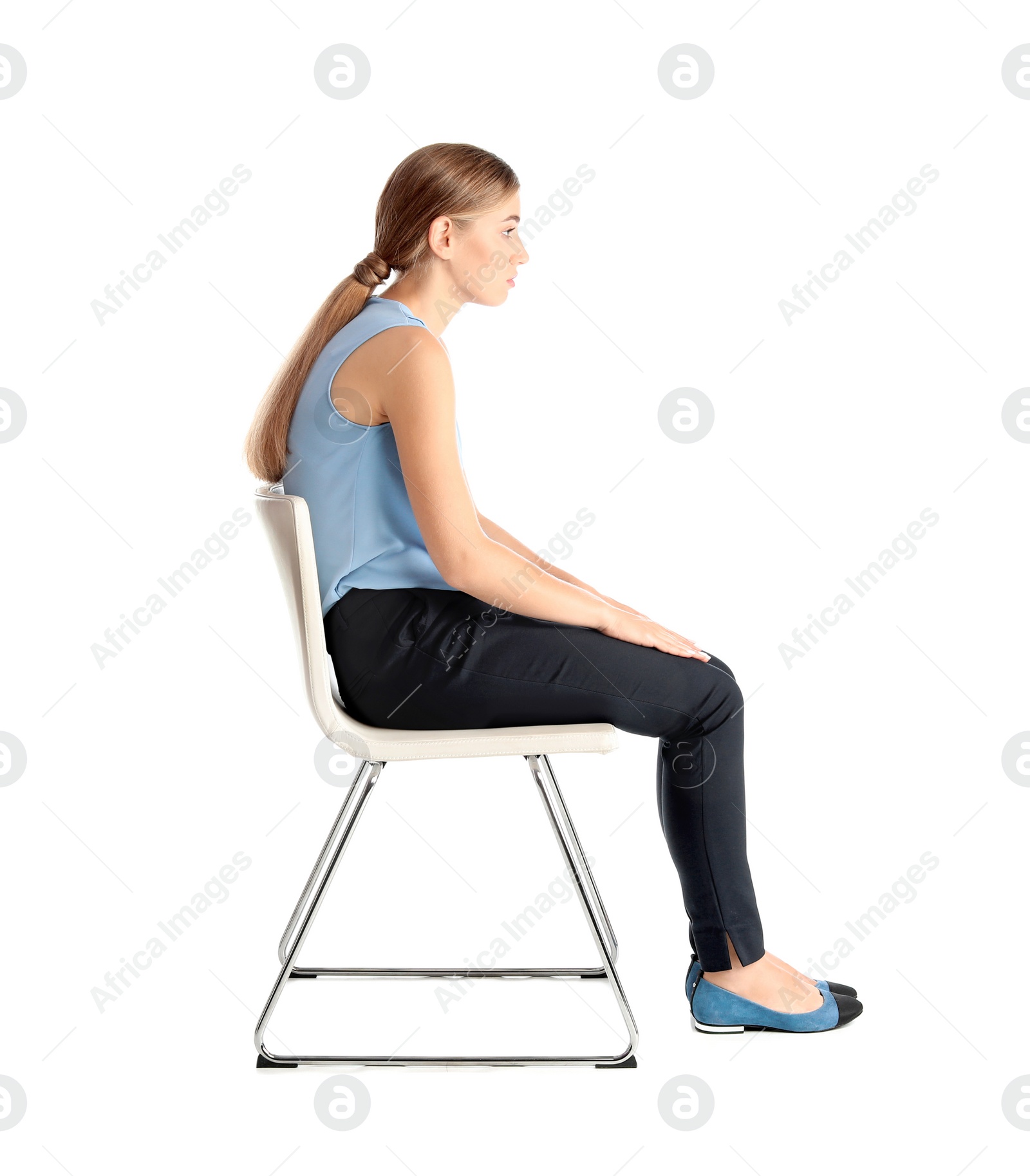 Photo of Woman sitting on chair against white background. Posture concept