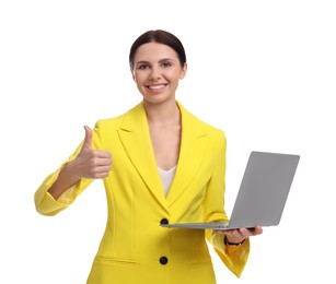 Beautiful happy businesswoman in yellow suit with laptop showing thumbs up on white background