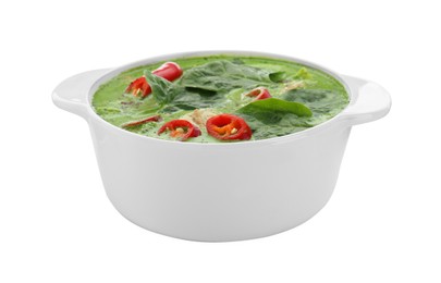 Photo of Saucepan of delicious green curry soup with chicken isolated on white
