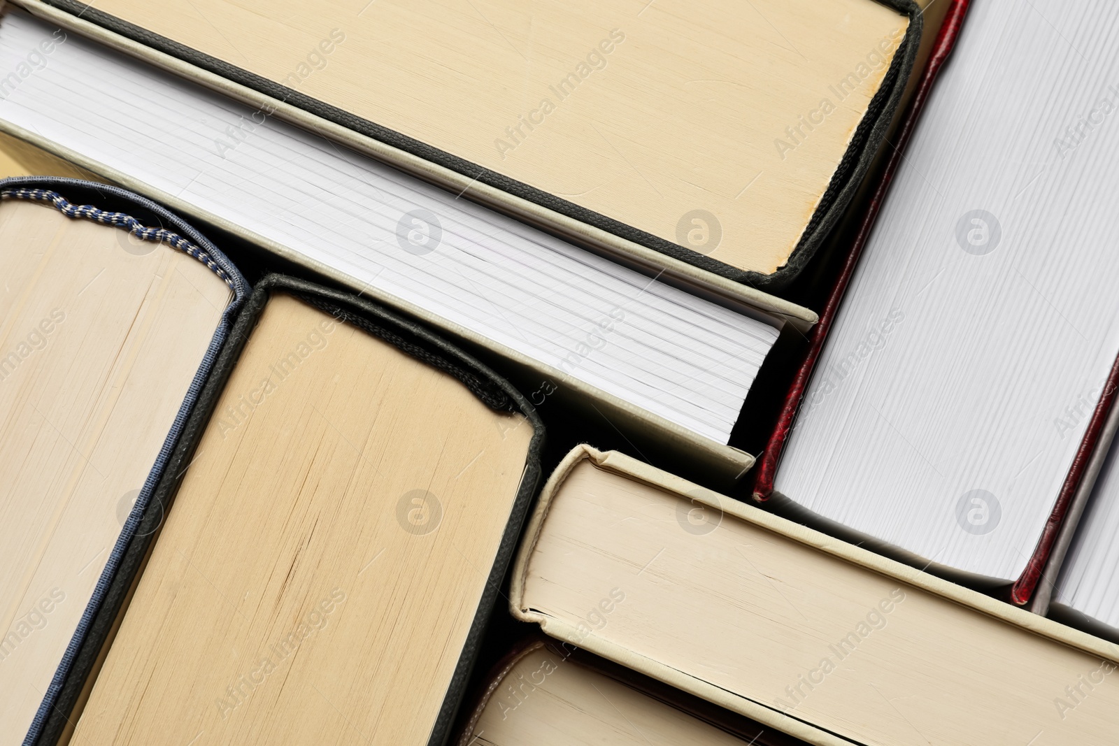 Photo of Many hardcover books as background, top view