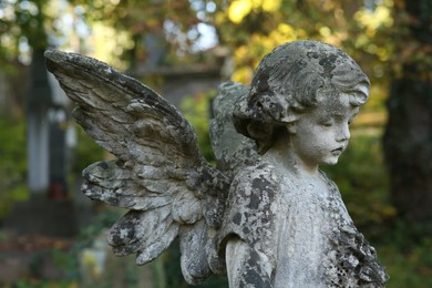 Beautiful statue of angel at cemetery. Religious symbol