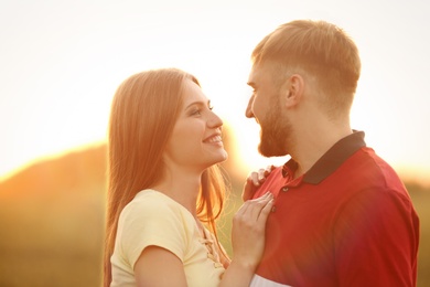 Happy young couple outdoors on sunny spring day