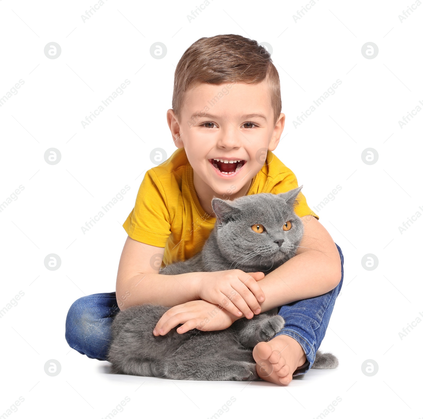 Photo of Cute little child with cat on white background