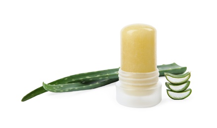 Photo of Natural crystal alum deodorant and fresh aloe on white background