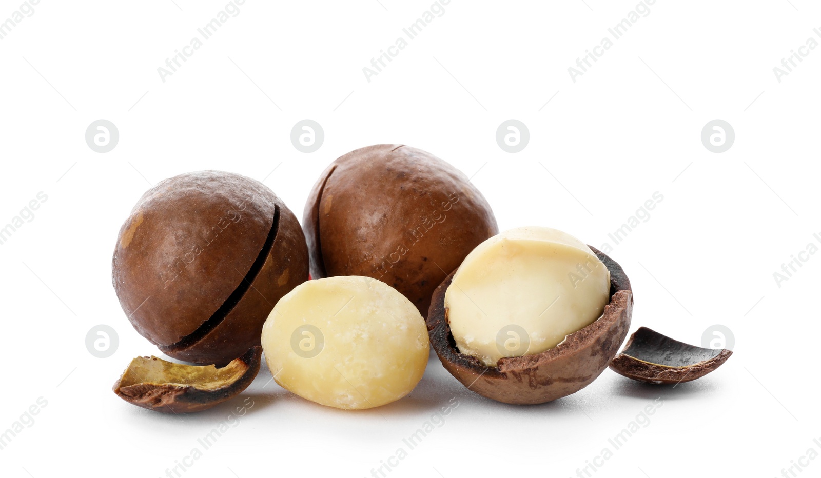 Photo of Pile of organic Macadamia nuts on white background