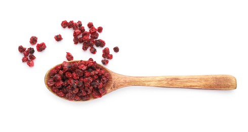 Photo of Dried red currants and wooden spoon on white background, top view
