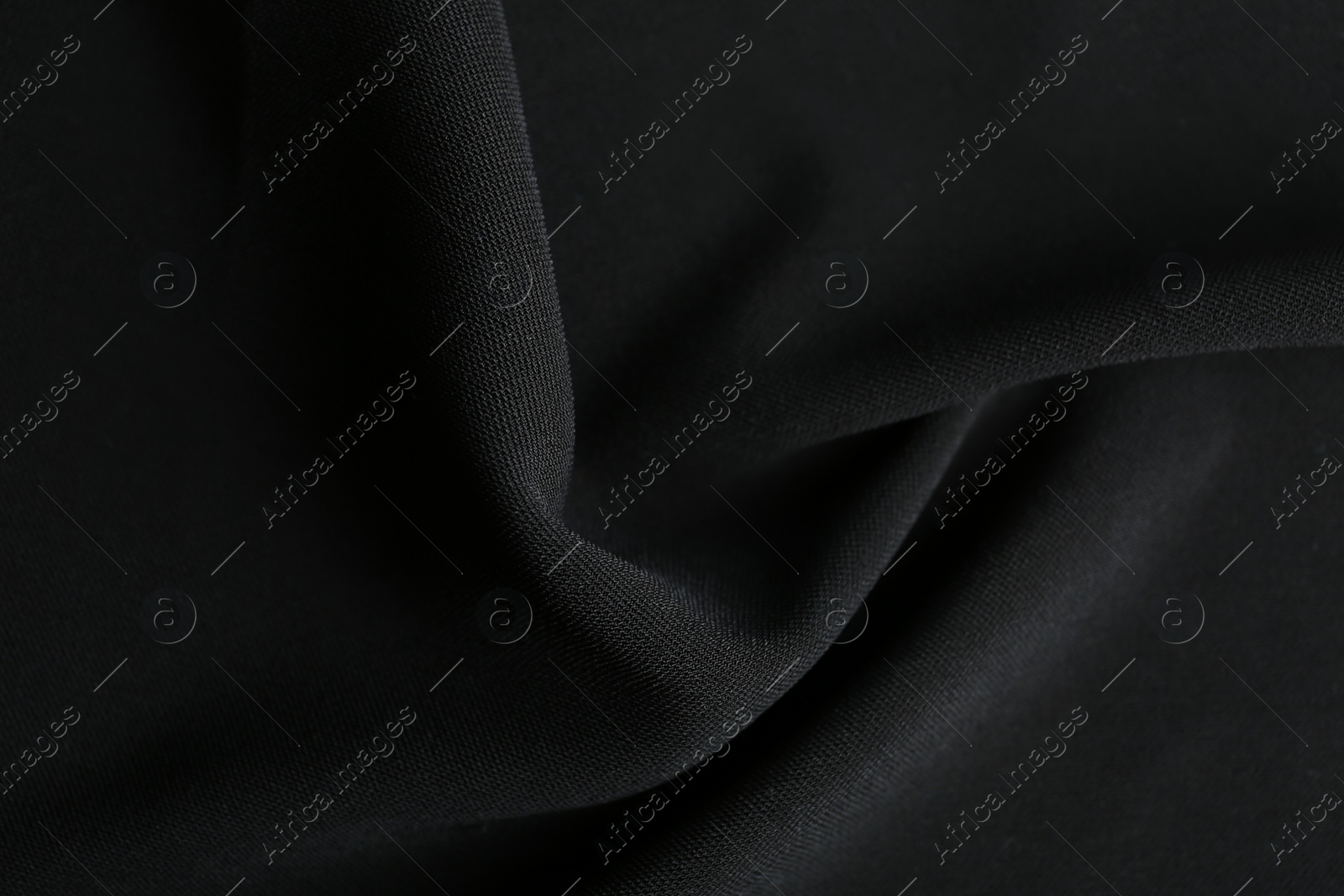 Photo of Texture of beautiful black fabric as background, closeup