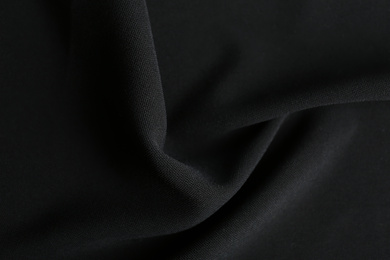 Photo of Texture of beautiful black fabric as background, closeup