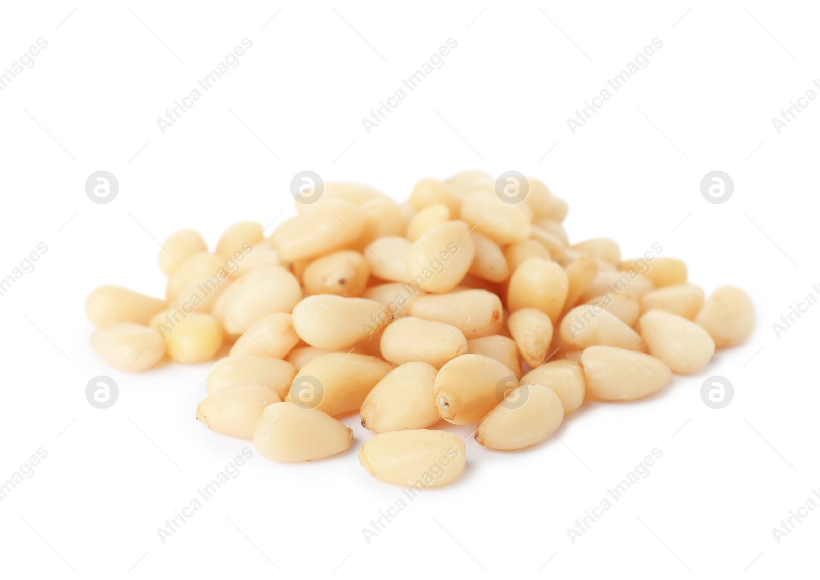 Photo of Heap of pine nuts on white background