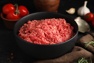 Photo of Fresh minced meat in bowl on table, closeup