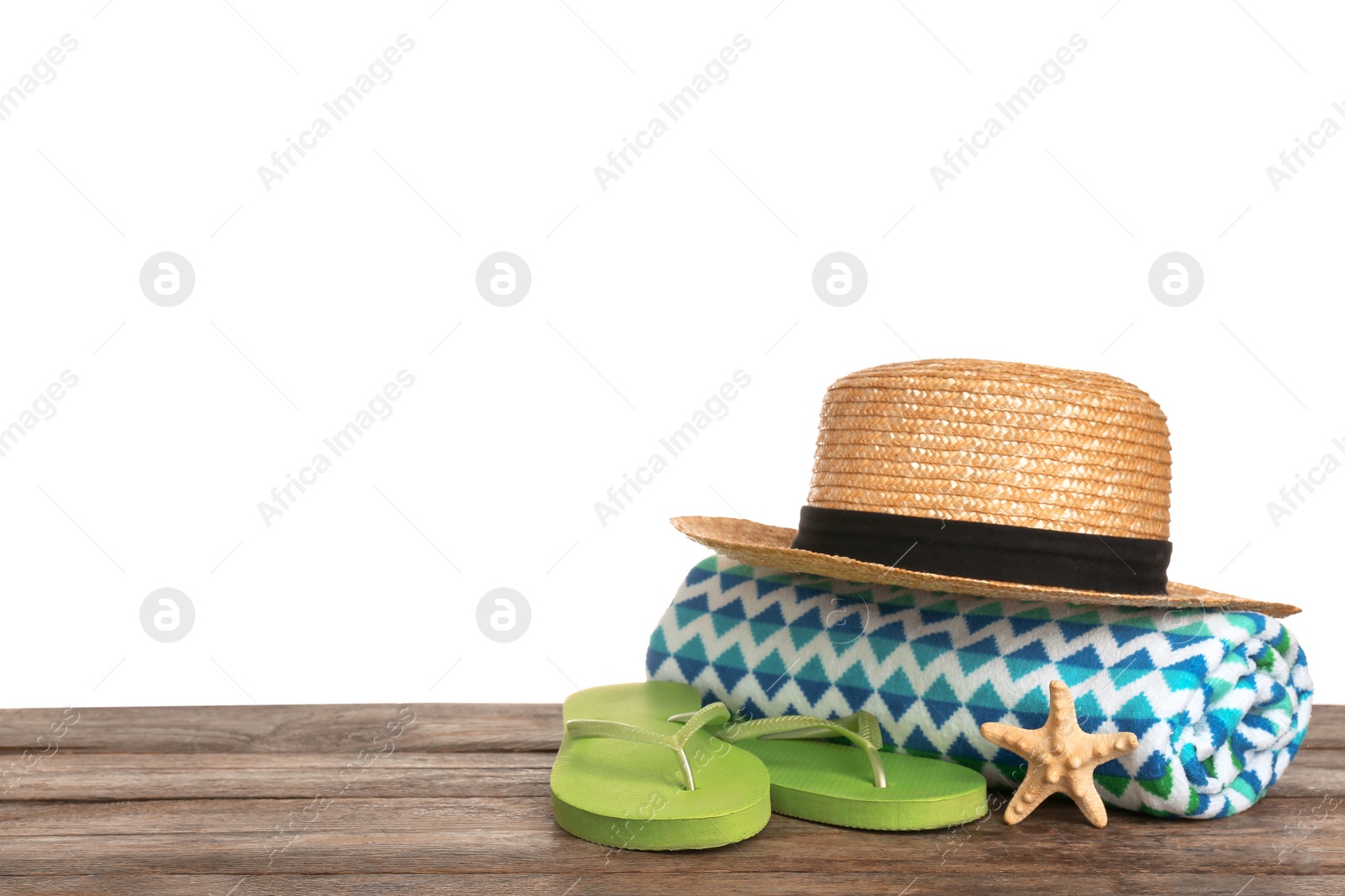 Photo of Set of different beach accessories on table against white background. Space for text