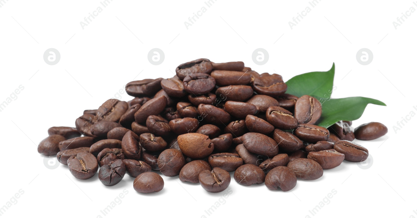 Photo of Pile of roasted coffee beans with fresh leaves on white background