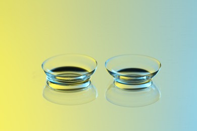 Pair of contact lenses on mirror surface