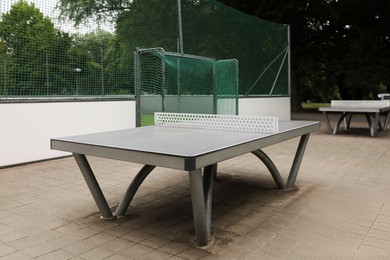Photo of Metal ping pong tables in city park