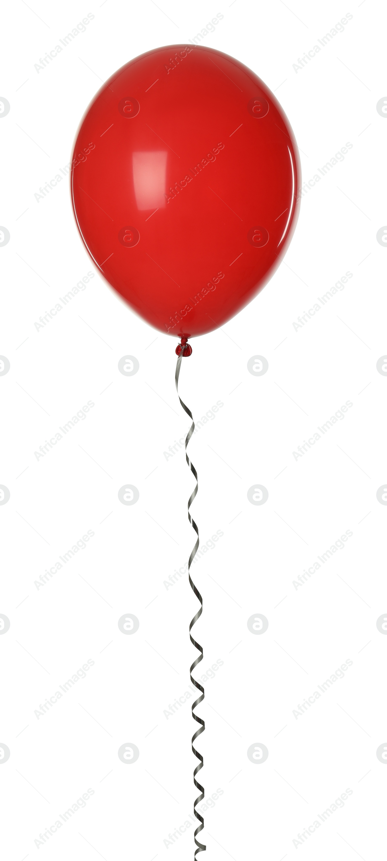 Photo of Red balloon with ribbon isolated on white