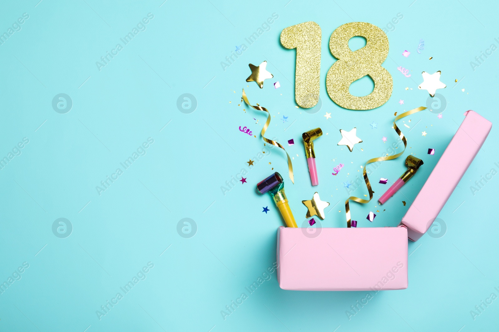 Photo of Flat lay composition with decor and numbers on light blue background, space for text. 18th birthday party