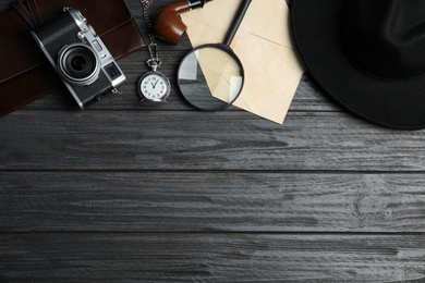 Photo of Flat lay composition with vintage detective items on grey wooden background, space for text