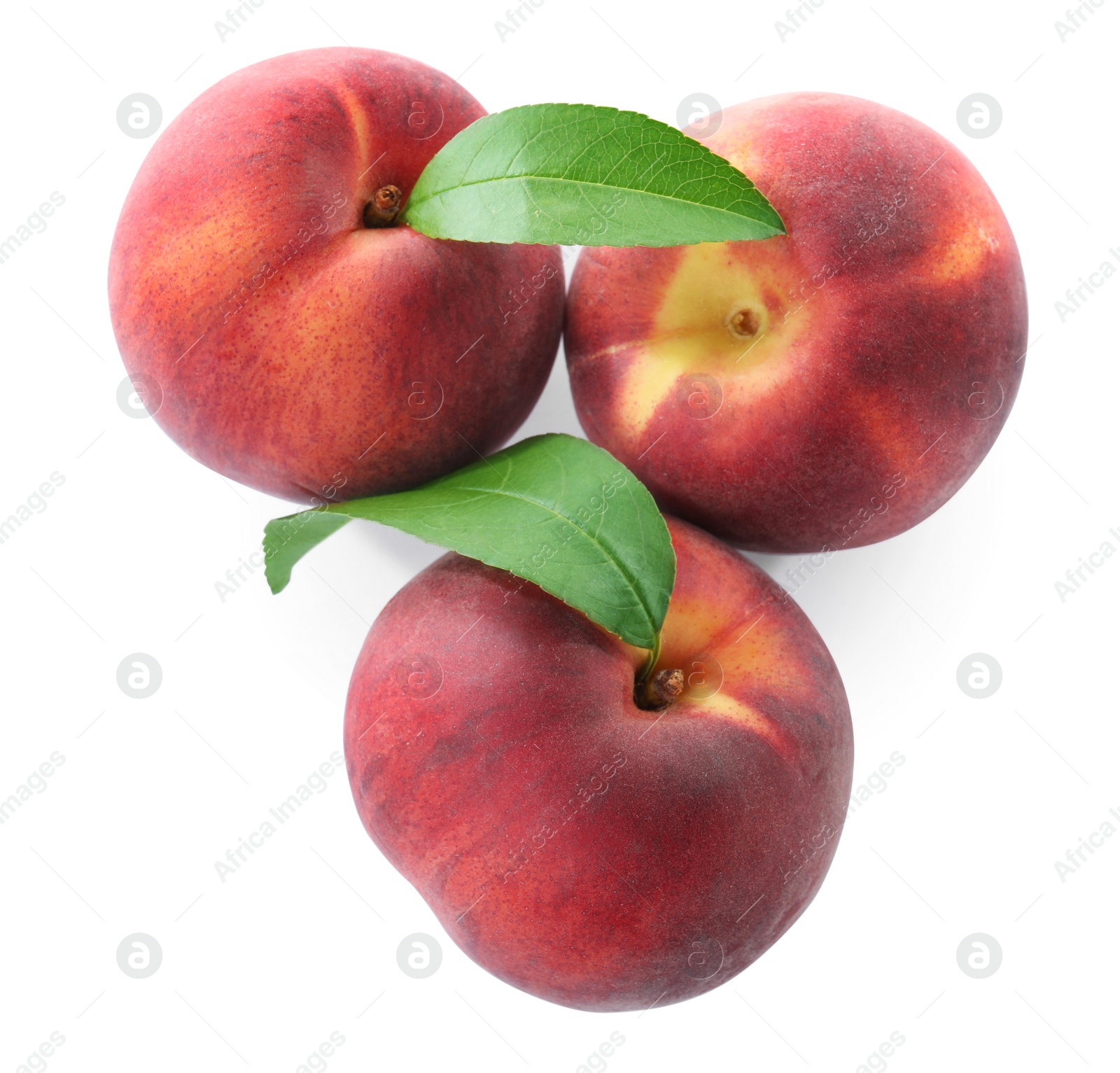 Photo of Sweet juicy peaches with leaves on white background, top view