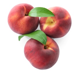 Sweet juicy peaches with leaves on white background, top view