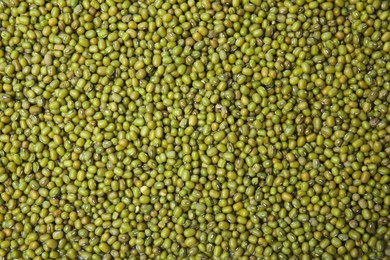 Photo of Green mung beans as background, top view