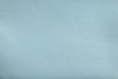 Light blue leather as background, top view