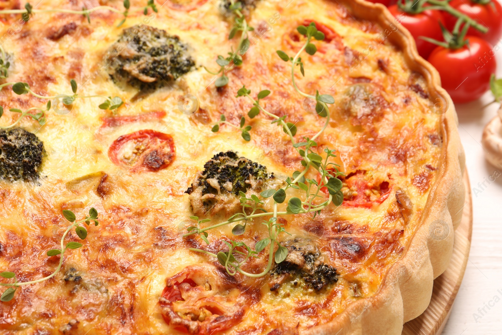 Photo of Delicious homemade vegetable quiche on table, closeup