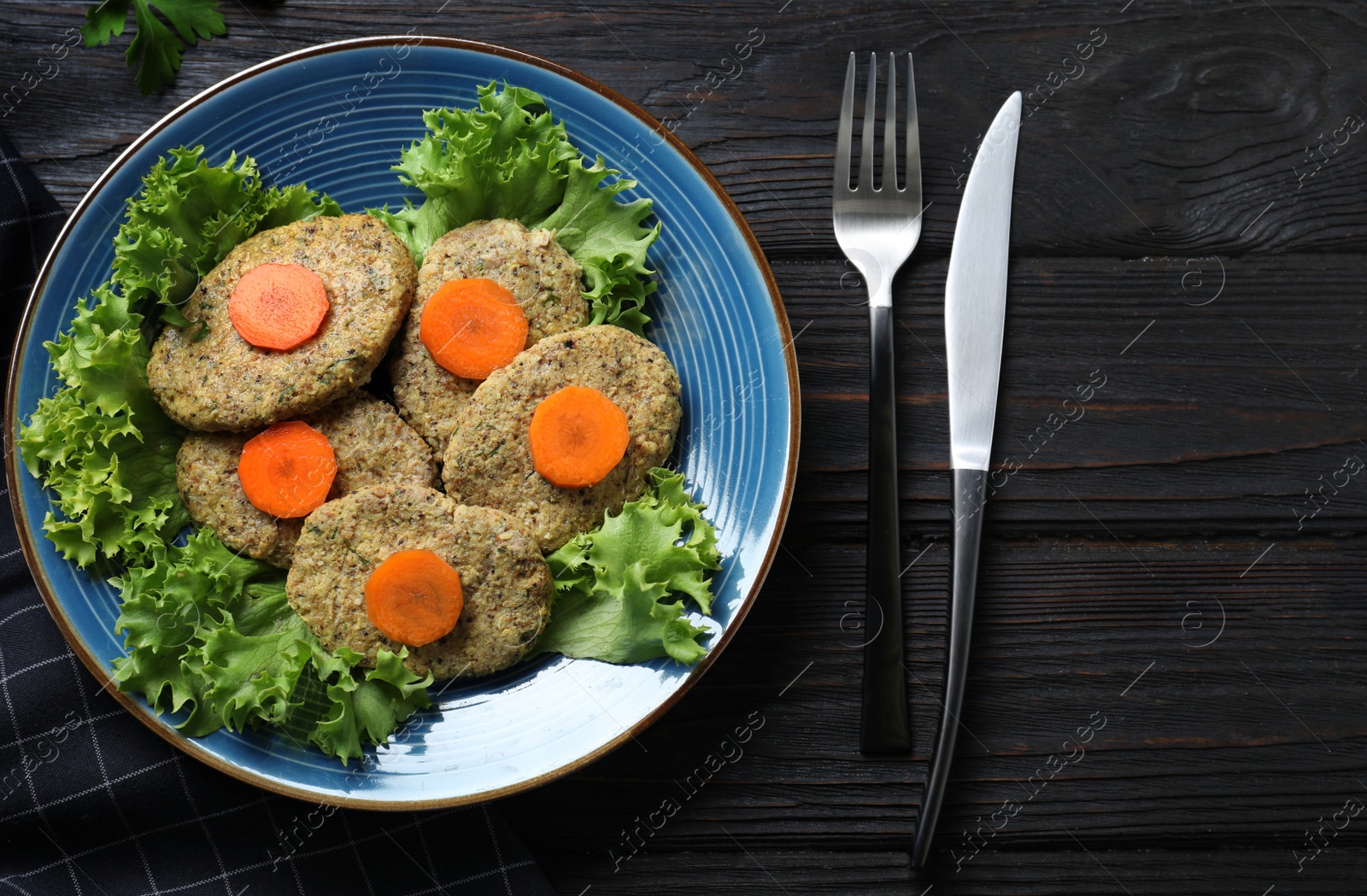 Photo of Flat lay composition with plate of traditional Passover (Pesach) gefilte fish on wooden background