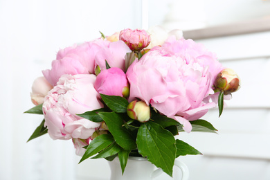 Photo of Bouquet of beautiful fresh peonies indoors, closeup