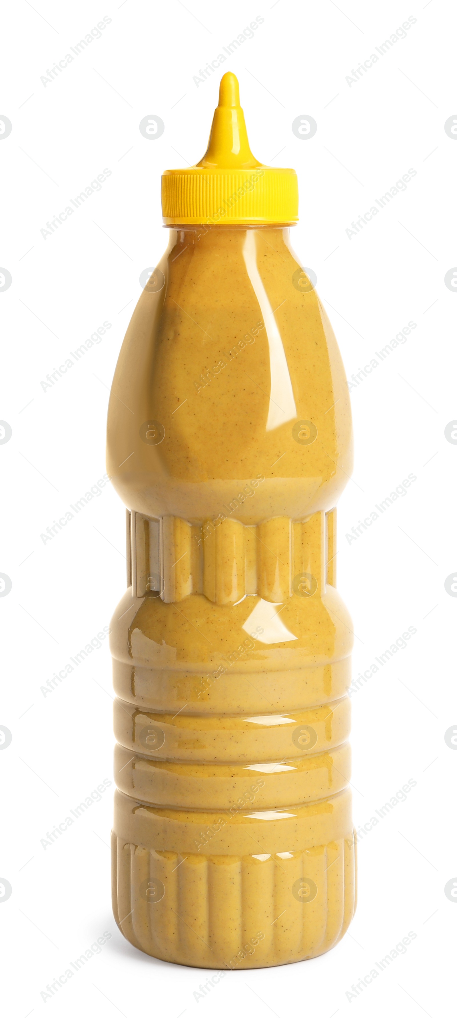 Photo of Spicy mustard in plastic bottle isolated on white