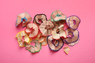 Pencil shavings on pink background, flat lay