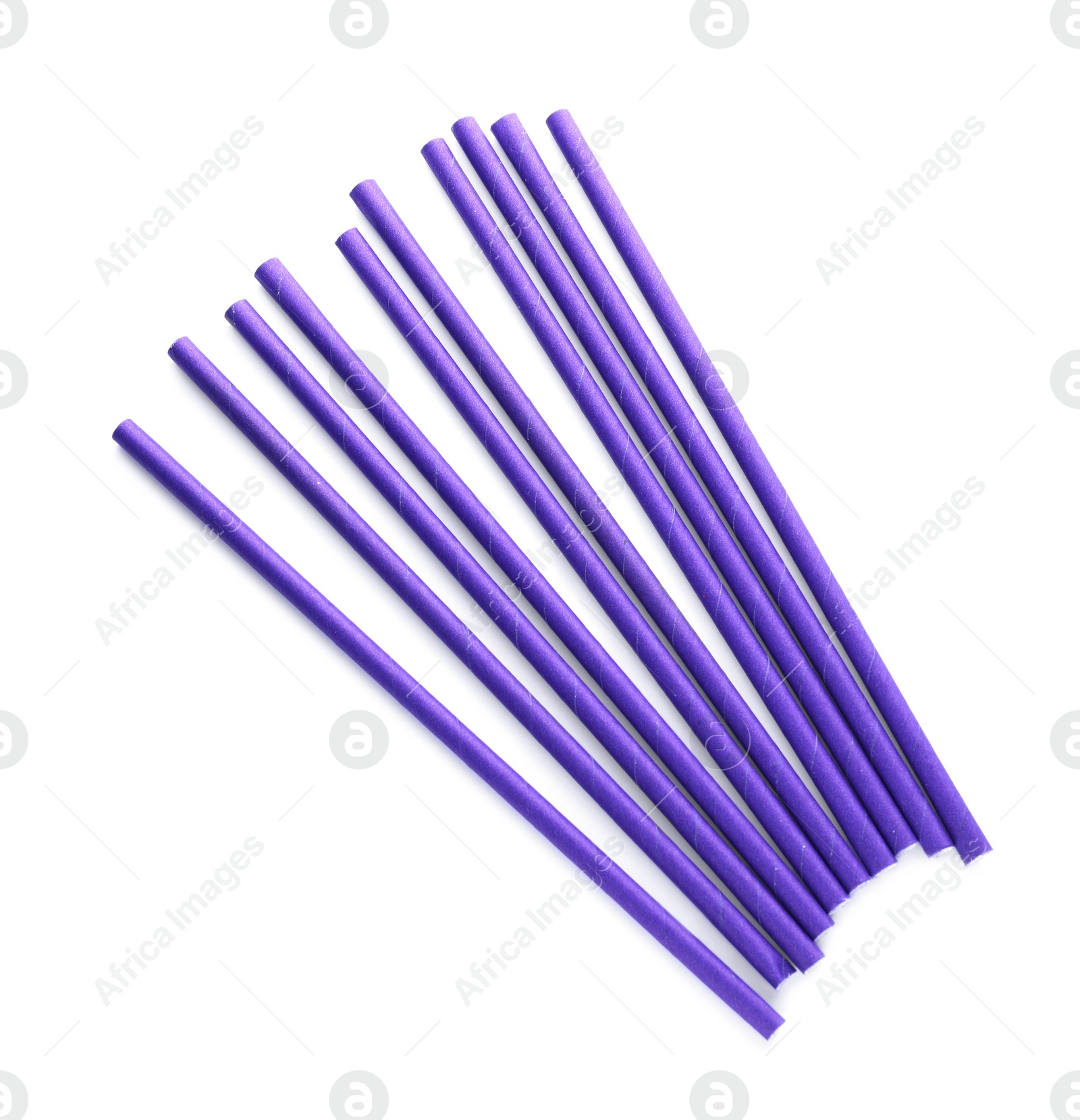 Photo of Purple paper cocktail straws on white background, top view