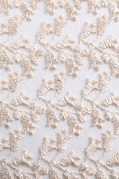 Photo of Beautiful beige lace as background, top view