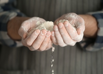 Photo of Man holding flour, closeup