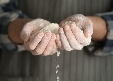 Man holding flour, closeup