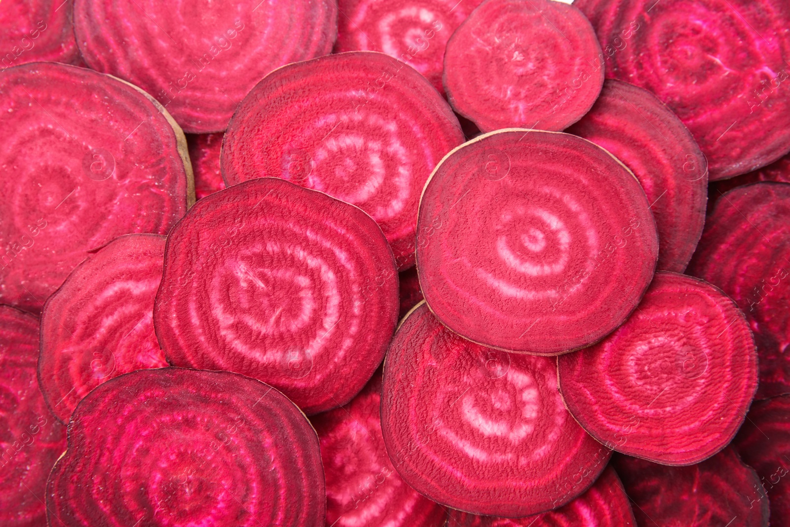 Photo of Sliced red beets as background, top view