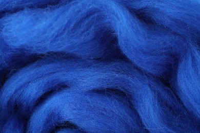 Blue felting wool as background, closeup view