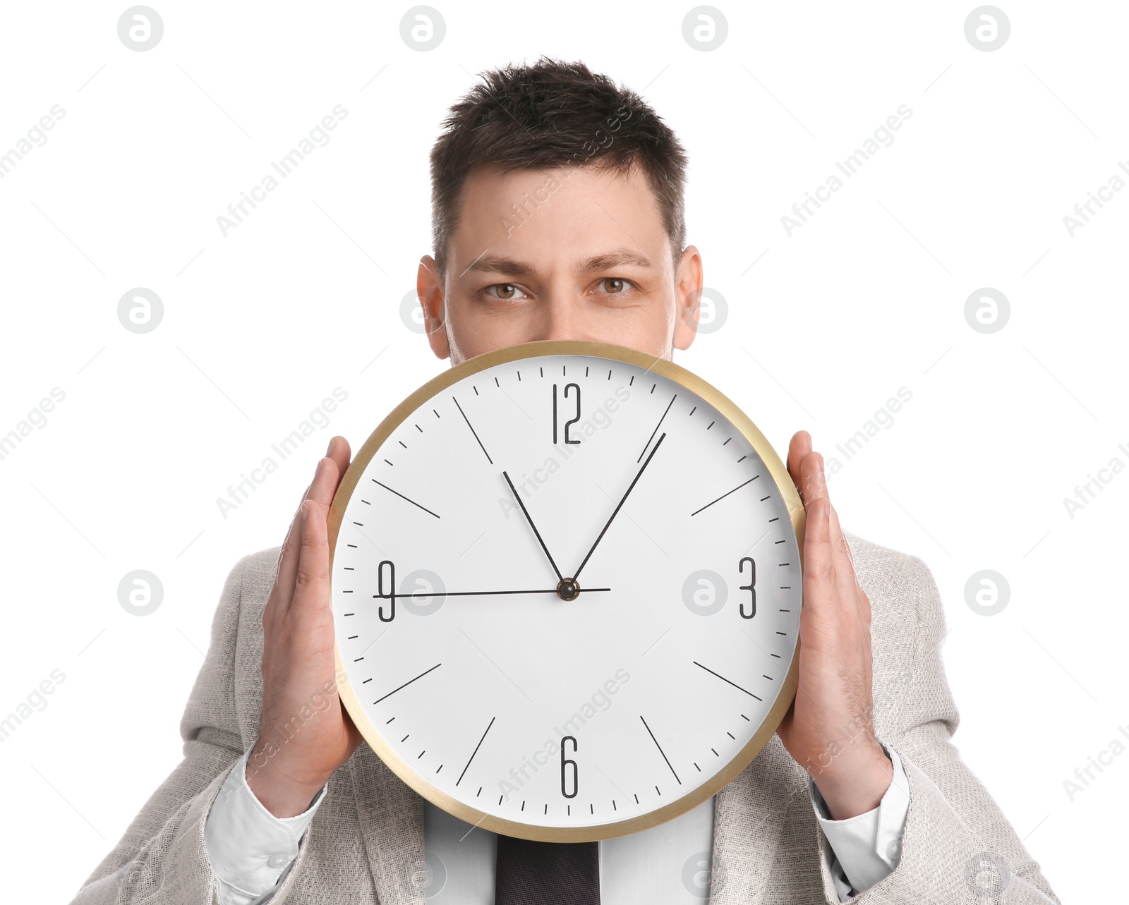 Photo of Businessman holding clock on white background. Time management