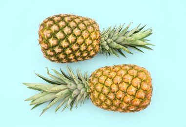Photo of Delicious ripe pineapples on white background, top view