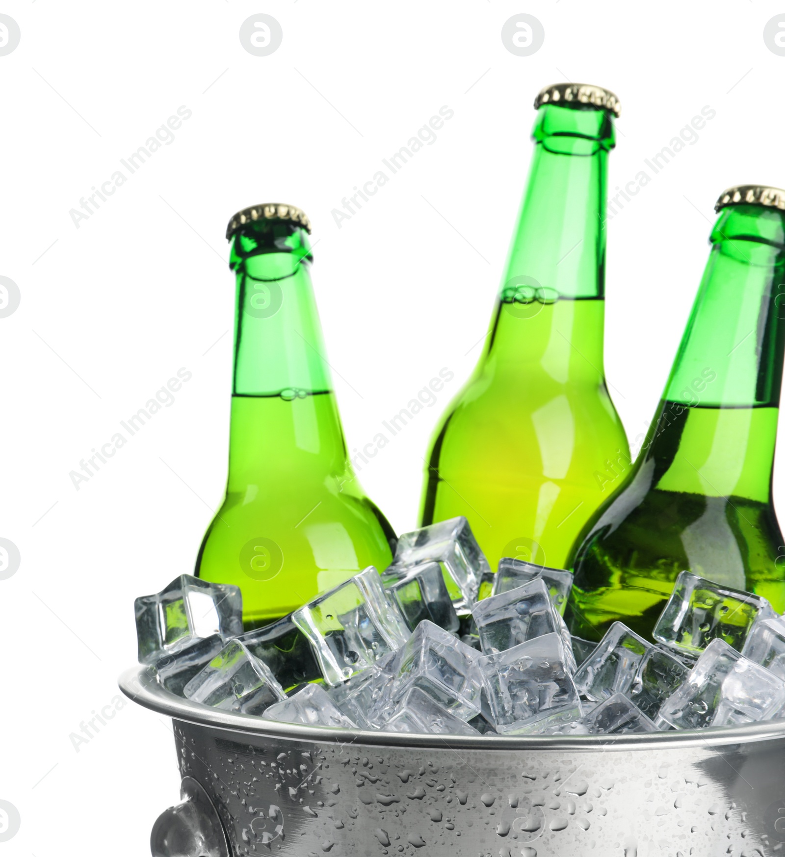 Photo of Metal bucket with bottles of beer and ice cubes isolated on white