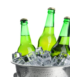 Photo of Metal bucket with bottles of beer and ice cubes isolated on white