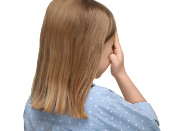 Photo of Little girl covering her eye on white background, back view