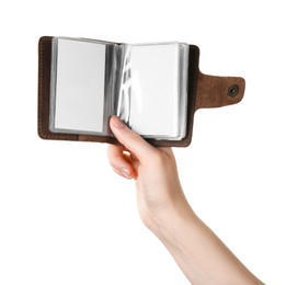 Photo of Woman holding leather business card holder with blank cards on white background, closeup