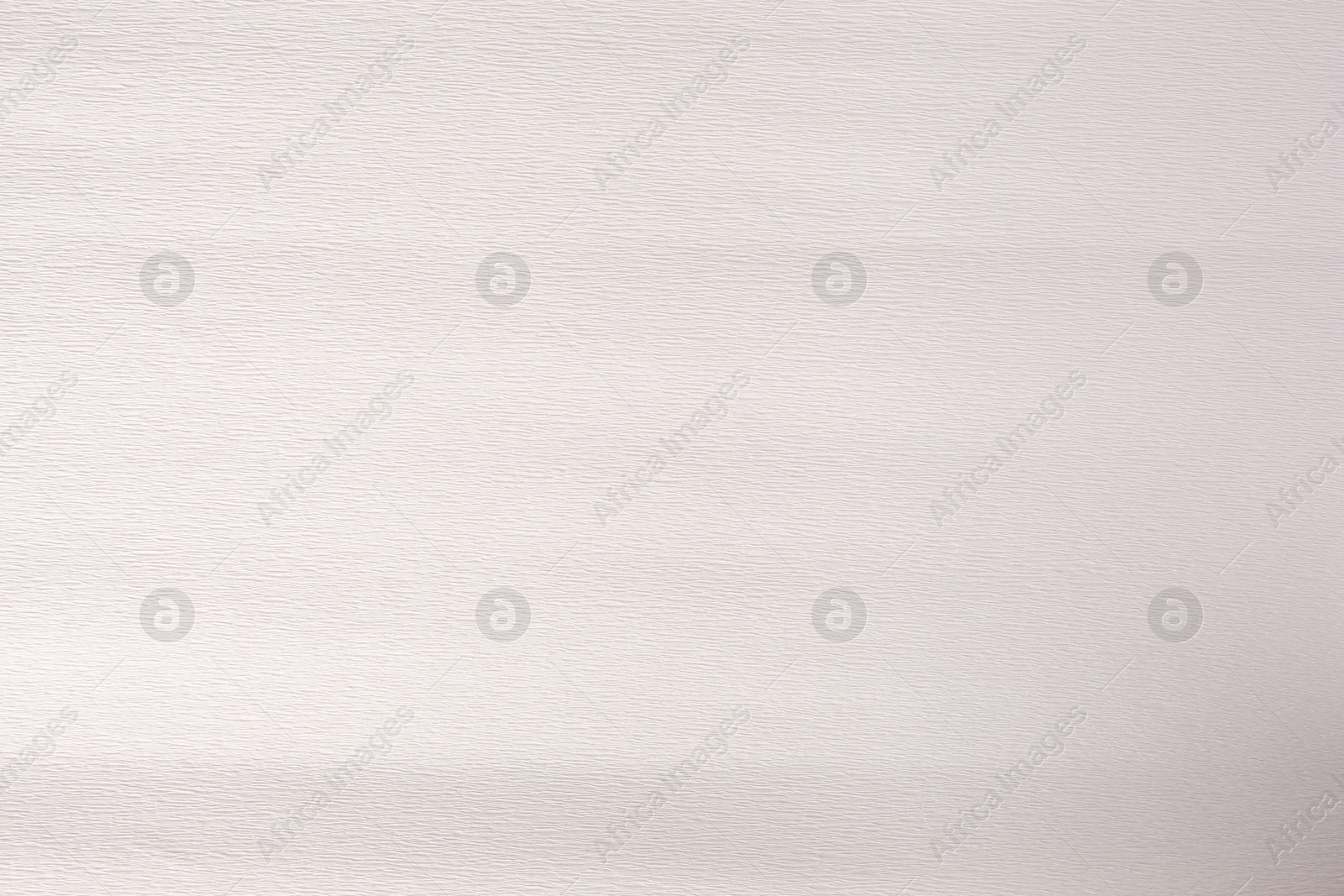 Photo of Texture of white paper sheet as background, closeup