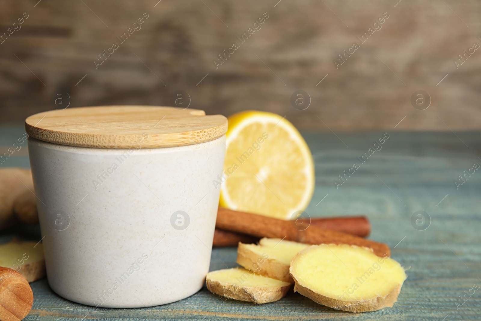 Photo of Composition with cold remedies on blue wooden table. Sore throat treatment