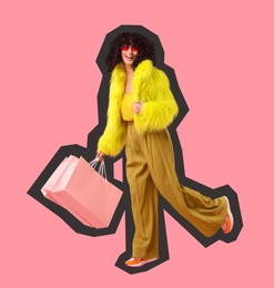 Happy woman with shopping bags on pink background